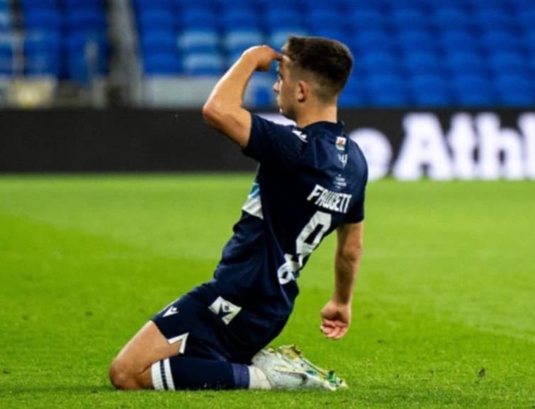Ben Fawcett salutes the crowd after scoring